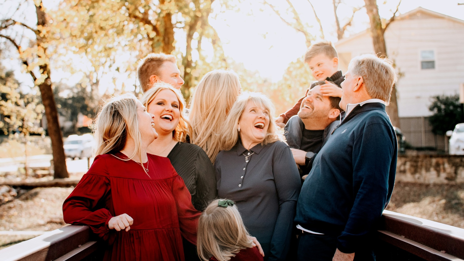 Multi-generational family laughing together outdoors